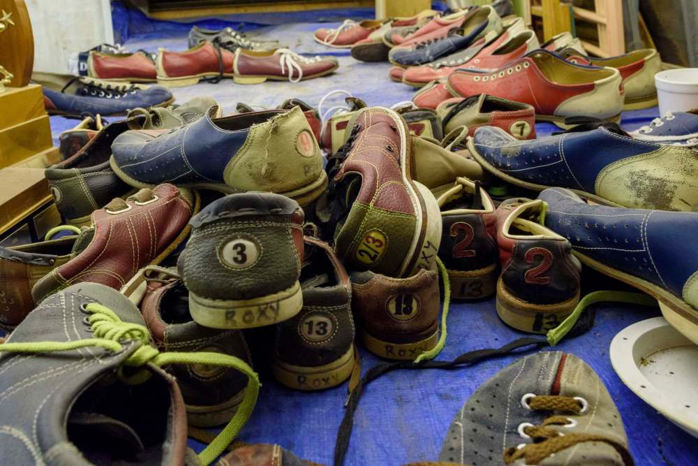 Piles of old shoes sit in many of the rooms in the basement at Roxy Lanes bowling alley. (Jesse Boily / Winnipeg Free Press)