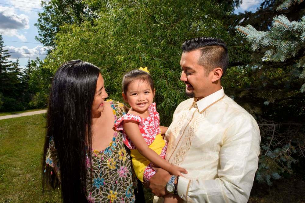 JESSE BOILY / WINNIPEG FREE PRESS
Godfrey Tamayo first met his wife, Nicole, while volunteering at the Pearl of the Orient Philippine Pavilion. Now the Folklorama experience is a way for them to teach a new generation, including daughter Mary, 3, about their Filipino roots.