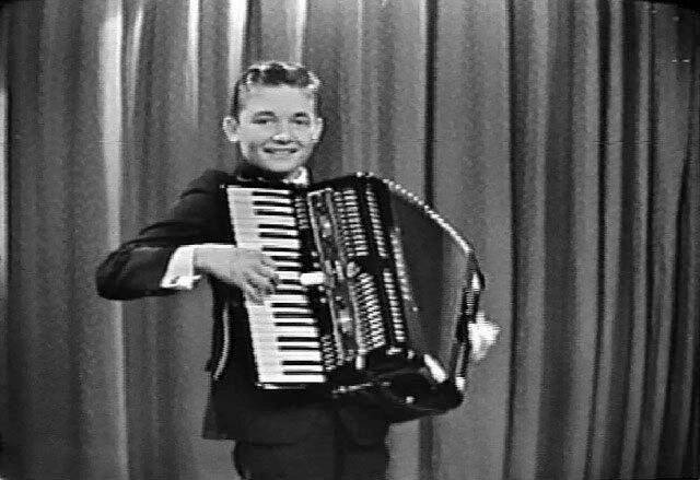 Paley playing the accordion around the age of 12 or 13. (Supplied)