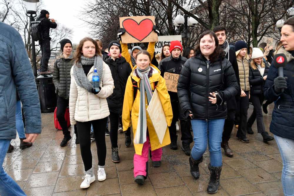 Henrik Montgomery / The Associated Press files
In this 2019 photo, activist Greta Thunberg (centre) and her sister Beata Ernman (left) take part in a climate protest in Stockholm, Sweden.