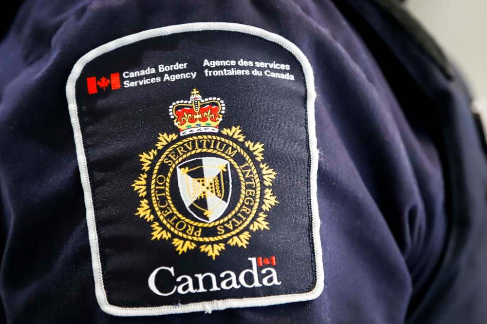 Manitoba RCMP receives a list each day of people who have crossed the border, along with a suggested check-in schedule. (Jeff McIntosh / The Canadian Press files)