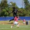 Valour FC&rsquo;s Julian Dunn goes up for a header against Cavalry FC on Aug. 16.
