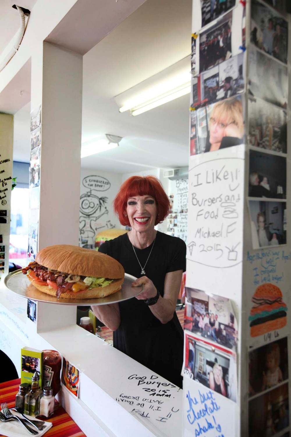 Ruth Bonneville / Free Press Files
Blondie’s Burgers owner Sandy Doyle shows off a nine-pound burger, one of the Main Street restaurant’s signatures.