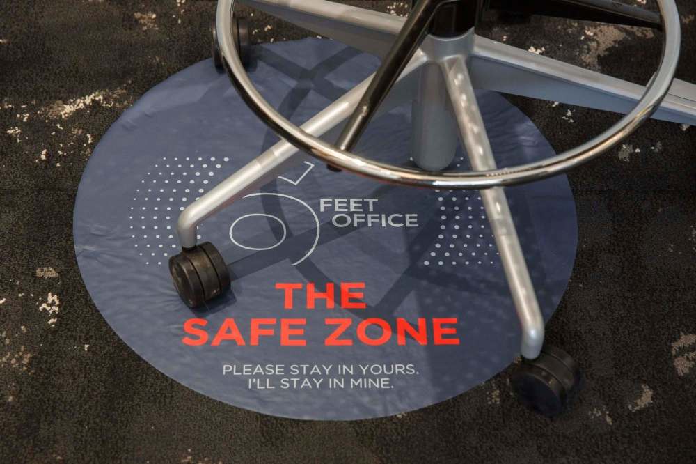 A chair sits on a “safe zone” sticker. (Mike Deal / Winnipeg Free Press)