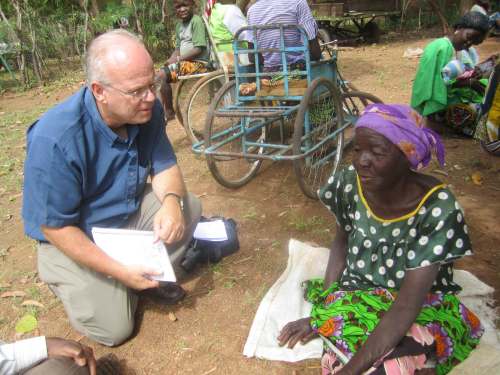 Jim Cornelius interviews Elizabeth Nabaloum, a widow who received food at a Foodgrains Bank-supported food distribution site in Burkina Faso. Elizabeth is one of 288,000 people in 2012 who received help through Foodgrains in the Sahel region of West Africa. (Submitted)