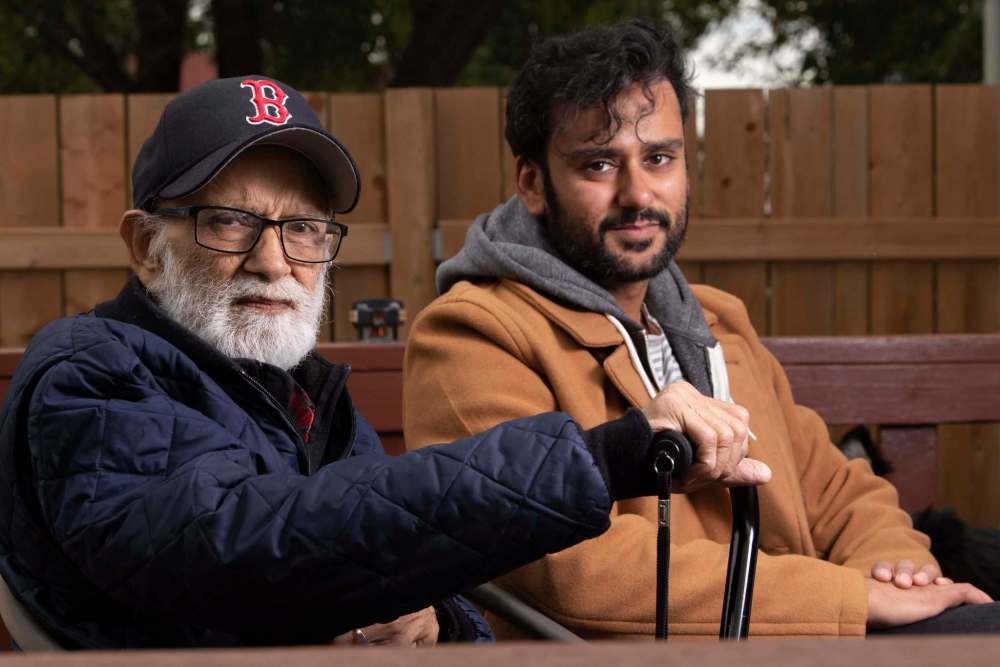 JESSE BOILY / WINNIPEG FREE PRESS
Local filmmaker Ian Bawa, right, joins his father Jagdeep Singh Bawa outside of his father's Winnipeg home. Bawa's latest film, Strong Son, which casts his father in a starring role has been selected for the Toronto International Film Festival.