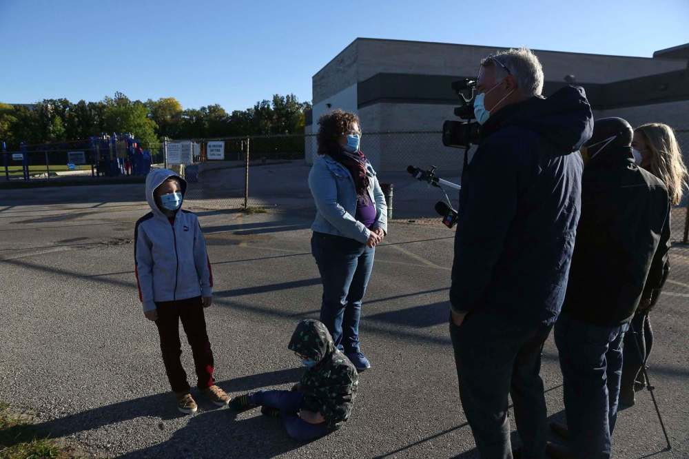 MIKE DEAL / WINNIPEG FREE PRESS
A parent speaks to the media oustide John Pritchard School Wednesday morning.