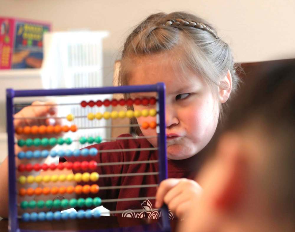 RUTH BONNEVILLE / WINNIPEG FREE PRESS
Kenny works on an abacus.