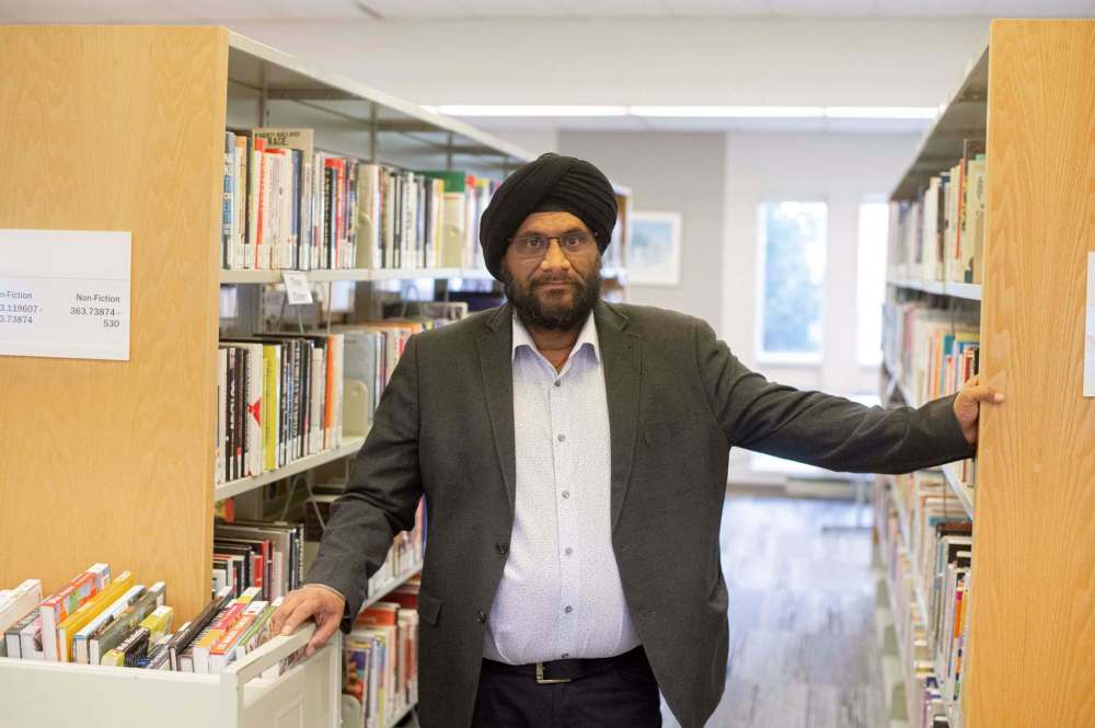 Jaideep Johar finds happiness in giving his time as a volunteer on the Winnipeg Public Library Board. ‘It feels great to be able to give back to the community and this beautiful city,’ he says. (Mike Sudoma / Winnipeg Free Press)