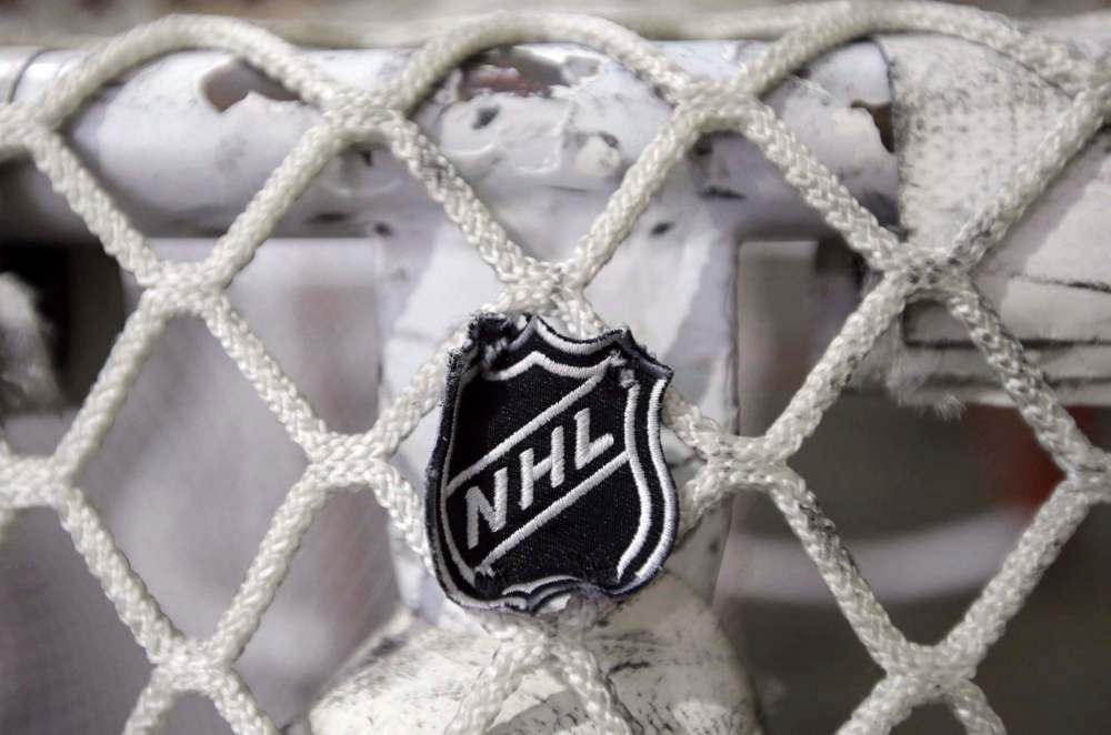 The NHL logo is seen on a goal at a Nashville Predators practice rink in Nashville, Tenn on Sept. 17, 2012. The league announced on Wednesday that it was temporarily halting its scouting combine, awards ceremony and draft that were scheduled for June amid the COVID-19 pandemic. It did not provide new dates for the events. THE CANADIAN PRESS/AP-Mark Humphrey
