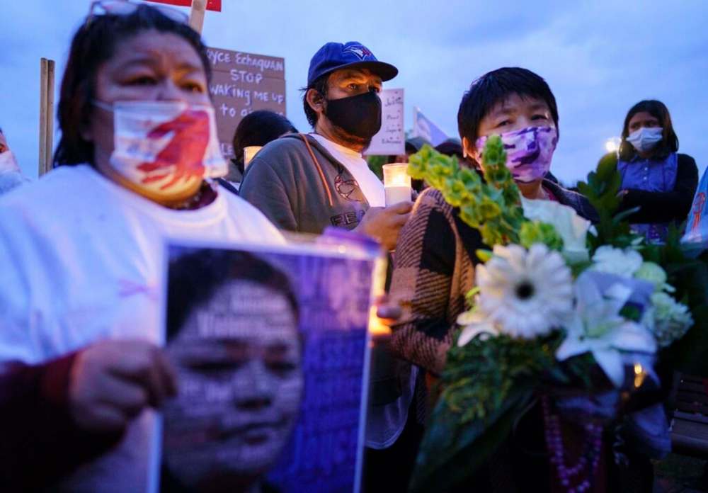 Carol Dube, husband of Joyce Echaquan and her mother Diane Echaquan Dube, right, attend a vigil in front of the hospital in Joliette, Que. on Tuesday, September 29, 2020. A nurse has been fired after an Indigenous woman who was dying Monday night in hospital was subjected to degrading remarks, Quebec's premier said Tuesday. THE CANADIAN PRESS/Paul Chiasson