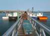 Andrew Vaughan / The Canadian Press
Members of the Sipekne'katik First Nation load lobster traps on the wharf in Saulnierville, N.S., on Thursday, Sept. 17.