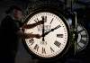 The Associated Press
Dan LaMoore adjusts the hands on a Seth Thomas Post Clock at Electric Time Company in Medfield, Mass. Daylight Saving Time ended at 2 a.m. Sunday.