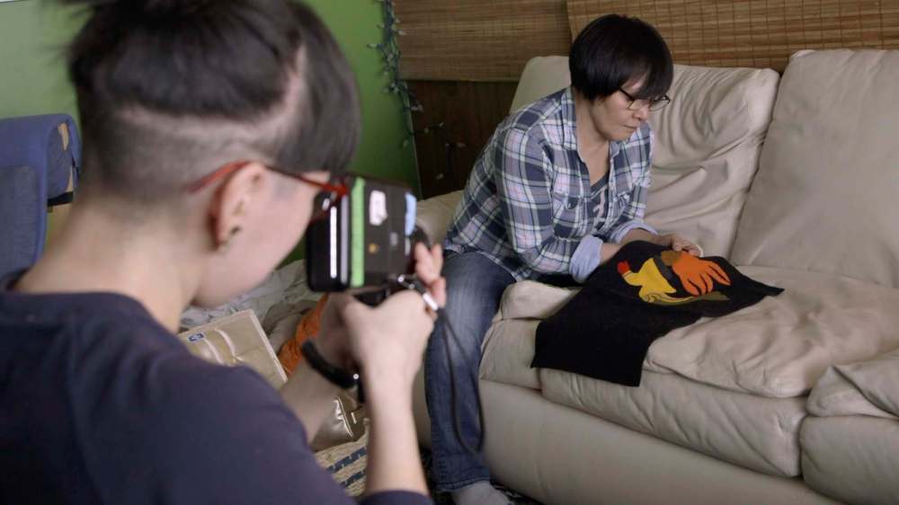 Supplied 
Artist Jocelyn Piirainen shoots video of carver Goota Ashoona.