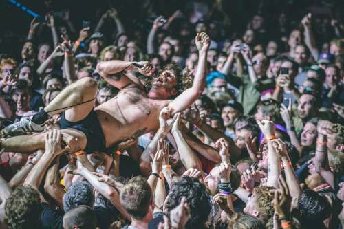 Mark Bowen, guitarist for the British punk group IDLES, surfs across the crowd during the band&rsquo;s performance at First Avenue in Minneapolis, MN. in 2019. (Mat Kleisinger photo)