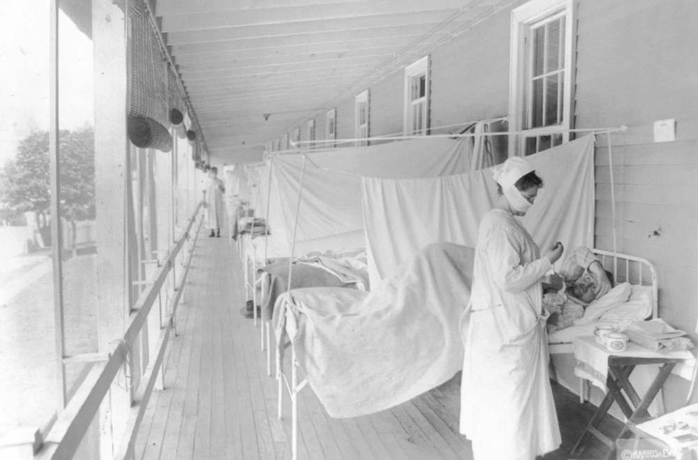 The Associated Press Files
A nurse takes the pulse of a patient in Walter Reed hospital in Washington during the influenza pandemic of 1918-19.