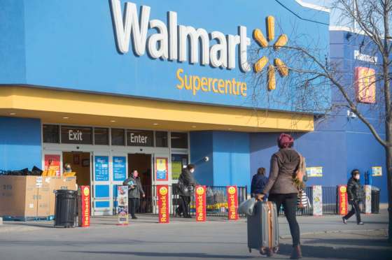 Mike Sudoma / Winnipeg Free PressShoppers stream in and out of a Walmart as they shop during the code red lockdown in Winnipeg on Monday.