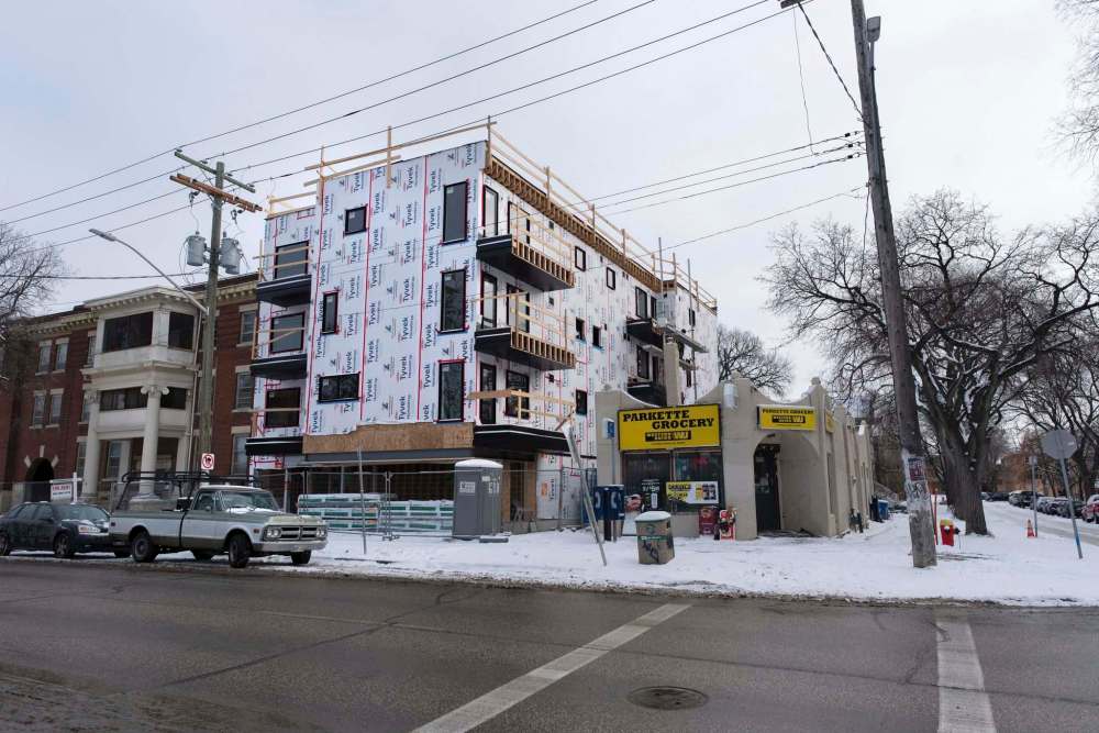 A 12-unit apartment block at 290 River Ave., designed by 2 Architecture, is about 60 per cent complete. (Jesse Boily / Winnipeg Free Press)