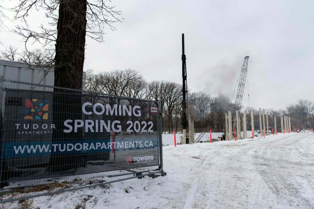 The construction of apartments by Pre-Con builders across from 290 River Avenue is one of the new developments in the area. (Jesse Boily / Winnipeg Free Press)
