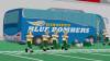 The video clip on the Simpsons shows several football players walking towards a Winnipeg Blue Bombers bus after a loss to the hometown Springfield Atoms.