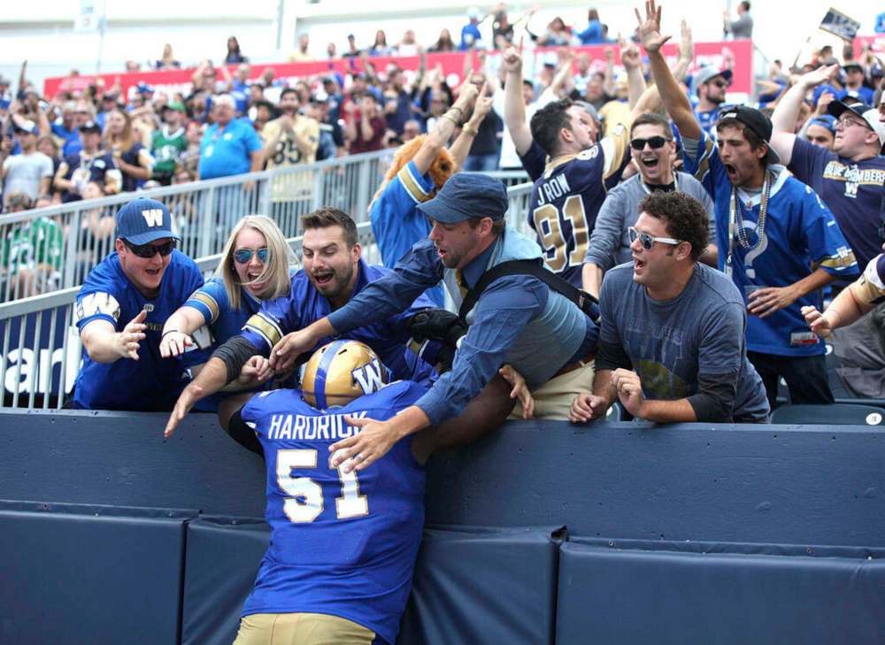 RUTH BONNEVILLE / WINNIPEG FREE PRESS FILES
Winnipeg Blue Bombers offensive lineman Jermarcus Hardrick gets some love from Bomber fans after the team scored a touchdown. It's safe to say the Bombers players are thinking about getting back to game action since the CFL released it's schedule for the 2021 season, Friday.