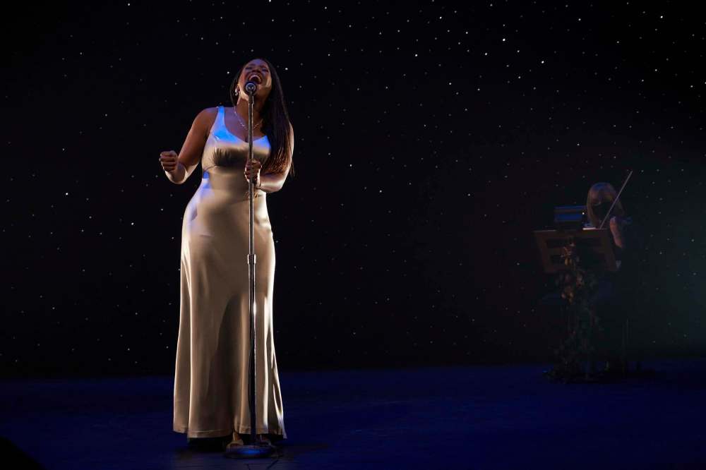 Photograph by Hugh Conacher
Lisa Bell sings in All Is Bright.