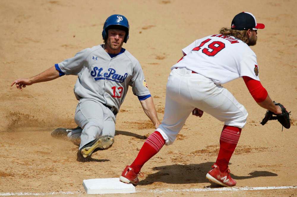 JOHN WOODS / WINNIPEG FREE PRESS FILES
Winnipeg Goldeyes' Kyle Martin waits for the throw as St. Paul Saints’ Max Murphy slides to 2nd during a game in 2019. The American Association rivals will face each other no more as the St. Paul Saints are leaving the independent league to become the new Triple-A affiliate for the Minnesota Twins in 2021.