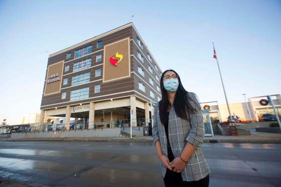 photos by MIKE DEAL / WINNIPEG FREE PRESSResearch co-ordinators Nora Choi, outside Grace Hospital, and Quinn Tays, outside St. Boniface General Hospital (below), are working with a team of researchers from other Winnipeg hospitals co-ordinating clinical trials with COVID-19 patients.