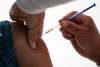 The province announced Wednesday it will hold back fewer doses of the two-shot Pfizer-BioNTech vaccine to allow more people to receive a first jab right away. (Marco Ugarte / The Associated Press files)