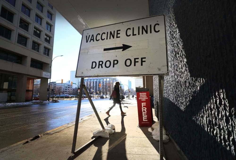 RUTH BONNEVILLE / WINNIPEG FREE PRESS
Andrea Wilkie-Gilmore, makes her way to the entrance of the convention centre to get her vaccine on Monday.