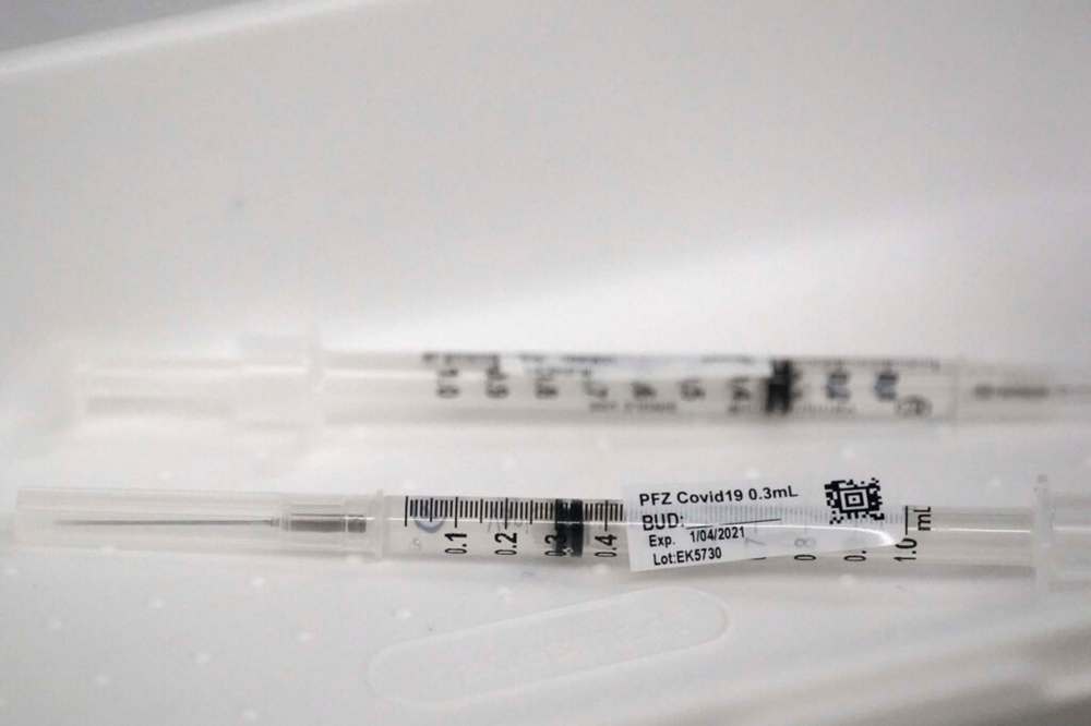 Syringes containing the Pfizer-BioNTech COVID-19 vaccine. (AP Photo/Wilfredo Lee)