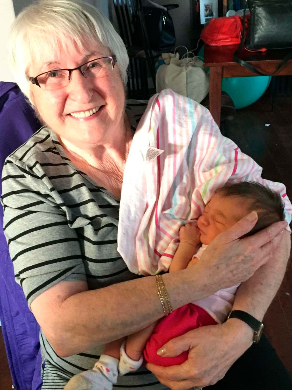 Supplied photos
Carmela Finkel, seen here holding one of her nine great-grandchildren, died in October due to complications from COVID-19.