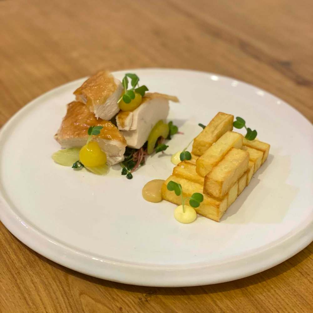 SUPPLIED
Azulay shows off a homemade dish of chicken, potatoes, pickled celery, horseradish aioli, mango gel, pineapple apple purée and radish sprouts.