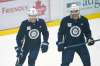 Winnipeg Jets' Mason Appleton (22) and Adam Lowry (17) joke during the first day of their NHL training camp in Winnipeg, Monday, January 4, 2021. THE CANADIAN PRESS/John Woods