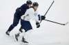 JOHN WOODS / WINNIPEG FREE PRESS 
Winnipeg Jets' Mark Scheifele (white jersey) and Jansen Harkins jostle for position during practice Sunday. Scheifele paced his teammates in ice time, logging a whopping 26 minutes and 21 seconds in the victory over the Flames last Thursday.