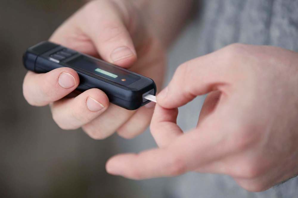JOHN WOODS / WINNIPEG FREE PRESS
Type 1 diabetics must place a drop of blood every three hours on the strip of a device such as this. A continuous glucose monitor instead uses sensors under the skin, but can cost up to $15,000 per year.