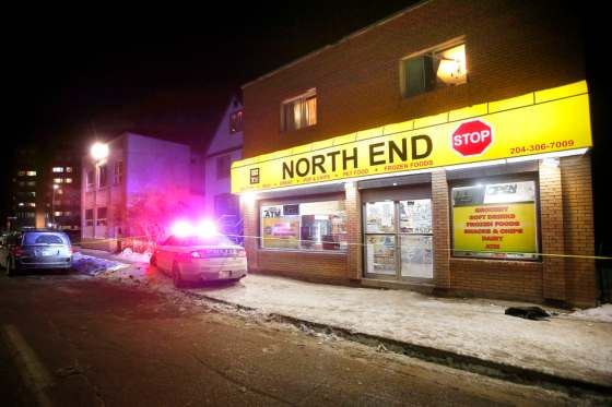 Police investigate on Selkirk Avenue in the North End on Monday evening. (John Woods / Winnipeg Free Press)
