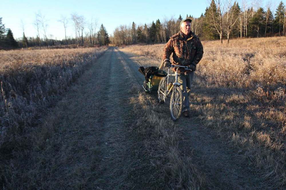 Crichton doing what he loved: looking for moose in Riding Mountain National Park in 2013. He had many admirers; his family would have expected hundreds to attend his funeral if it weren’t for pandemic restrictions. (Joe Bryksa / Winnipeg Free Press files)