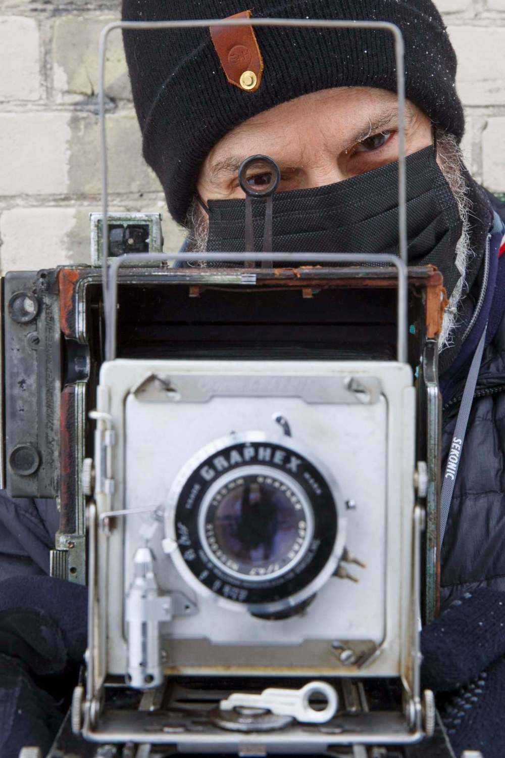 Keith Levit with his large-format 4x5 camera he’s used to take photos of street scenes in downtown Winnipeg. (Mike Deal / Winnipeg Free Press)