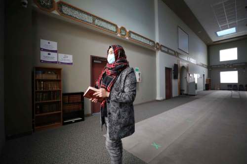 RUTH BONNEVILLE / WINNIPEG FREE PRESS
Urooj Danish, officer manager, in Grand Mosque space where X's are marked on floor for prayer spacing.