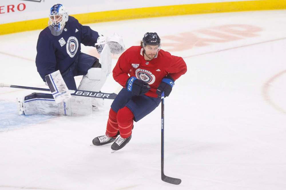 MIKE DEAL / WINNIPEG FREE PRESS
Winnipeg Jets defender Tucker Poolman is back on the ice and eager to get into a game. However, he likely won’t play Tuesday against the Calgary Flames.
