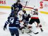 John Woods / The Canadian Press
Winnipeg Jets goaltender Connor Hellebuyck (37) saves the shot as Ottawa Senators’ Derek Stepan (21) and Colin White (36) attack during first period NHL action in Winnipeg on Thursday.