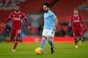 Manchester City's Ilkay Gundogan runs with the ball during the English Premier League soccer match between Liverpool and Manchester City at Anfield Stadium, Liverpool, England. (Tim Keeton/Pool via AP)