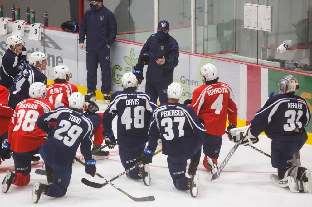 MIKE DEAL / WINNIPEG FREE PRESS Manitoba Moose head coach Pascal Vincent talks to players during training camp at BellMTS Iceplex in late January.