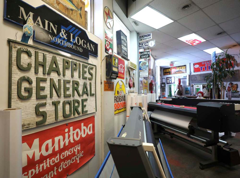 RUTH BONNEVILLE / WINNIPEG FREE PRESS
The walls of the office and warehouse at 1520 Notre Dame are a veritable museum — go from room to room and you’ll spot wooden signs, tin signs, and much more.