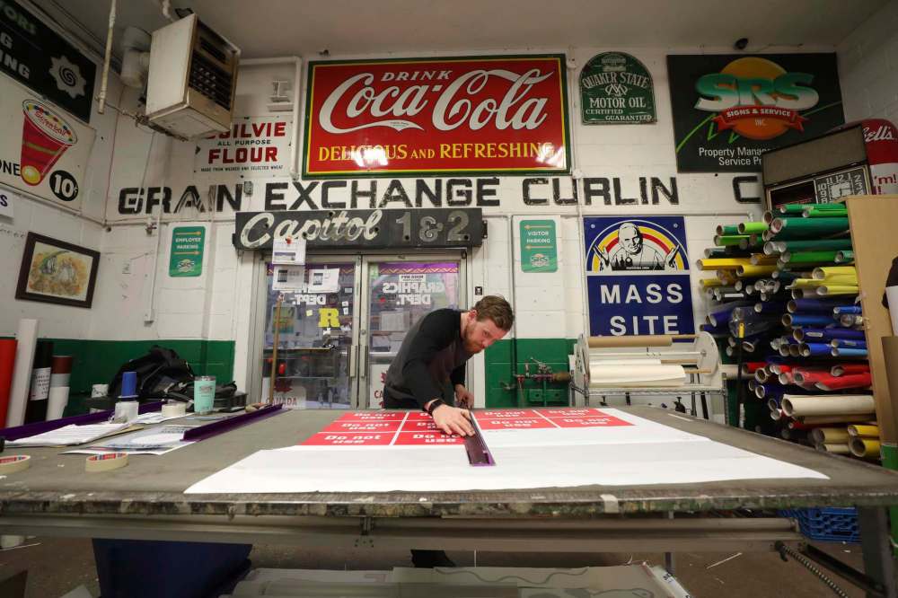 RUTH BONNEVILLE / WINNIPEG FREE PRESS
Storie says his employees, while making a new sign for a business take inspiration from the artifacts around them.