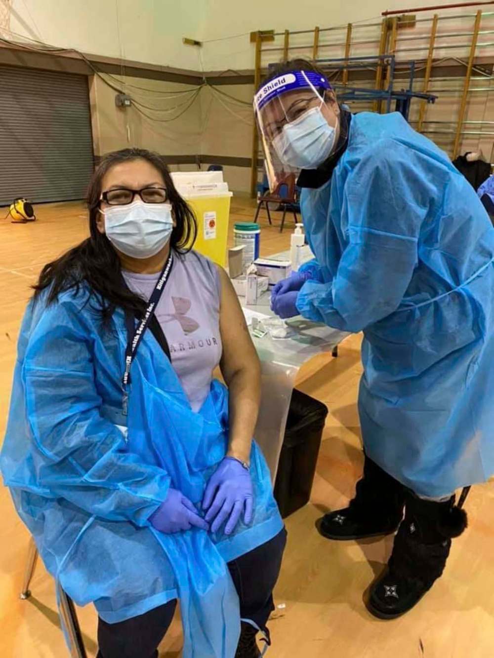 Four Arrows Regional Health Authority
Garden Hill community worker Allinda Munroe got her first Moderna shot last month from Island Lake nurse Sharon Monias.