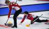 Jeff McIntosh / The Canadian Press
Second Katherine Doerksen applies the brush while skip Beth Peterson releases a shot during a practice session at the Scotties Tournament of Hearts in Calgary on Thursday.
