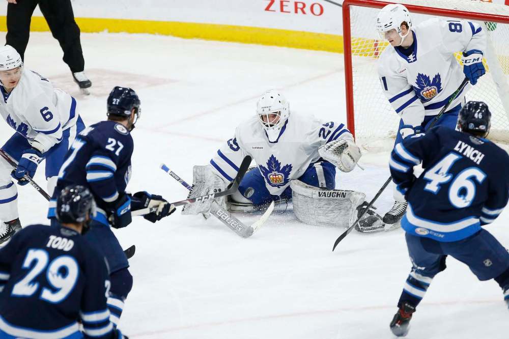 JOHN WOODS / WINNIPEG FREE PRESS files
The play of linemates Nathan Todd, Tyler Graovac and Bobby Lynch (from left) is making Moose head coach Pascal Vincent look like Toe Blake.
(27) takes the shot on Toronto Marlies goaltender Andrew D’Agostini (29) during second period AHL action in Winnipeg on Sunday, February 16, 2021.
Reporter: McIntyre