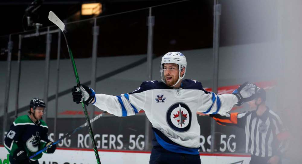 Pierre-Luc Dubois celebrates after scoring the game-winning goal in overtime against the Vancouver Canucks Sunday. (TREVOR HAGAN / WINNIPEG FREE PRESS)